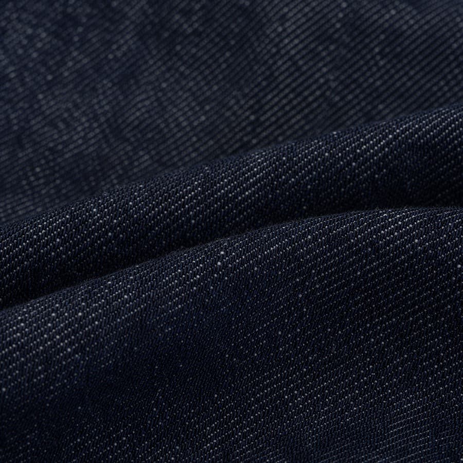 Macro photograph of indigo raw denim twill.